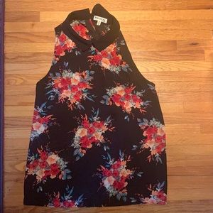 Black sleeveless blouse with colorful flowers